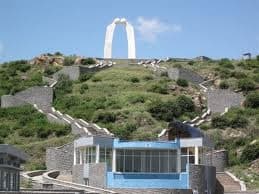 A hillside monument on the green slopes above Adama.