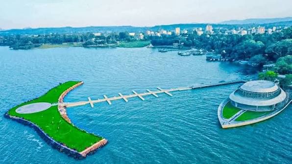 An aerial view of the Lake Tana shore at Bahir Dar, with a pier reaching out to a circular lakeside pavilion.